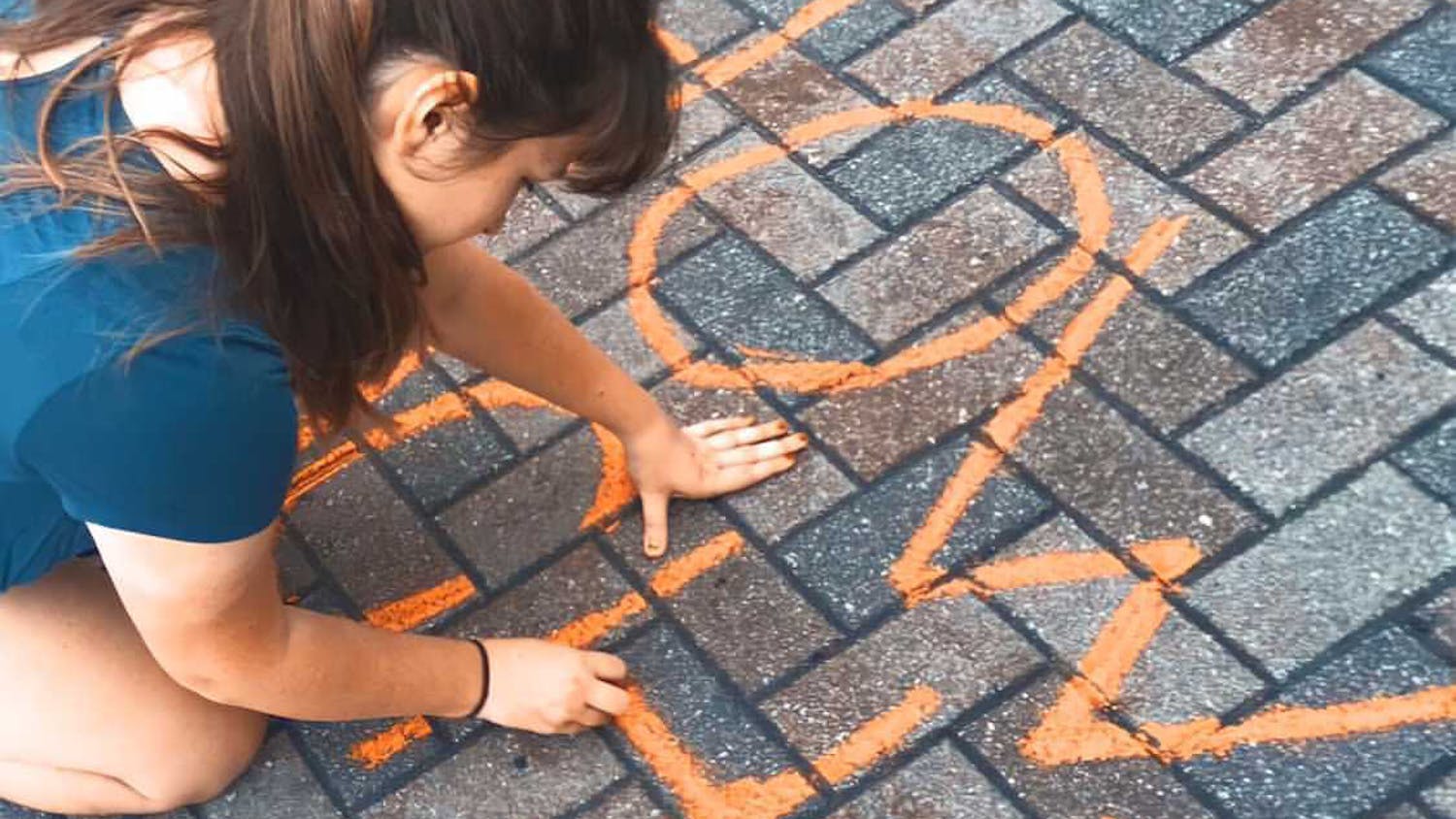 The organization chalks messages on the sidewalks of Gainesville to raise awareness about street harassment. 