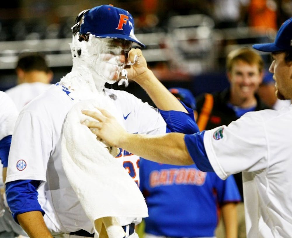 <p>Sophomore Jonathon Crawford reacts after teammates threw a pie in his face following his no-hitter against Bethune-Cookman in the NCAA Gainesville Regional opener June 1.</p>