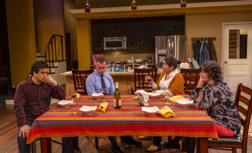 (L-R) Actors Alberto Bonilla, Tim Altmeyer, Maylin Castro and Maryann Towne at the dinner table in the Hippodrome's "The Blameless."