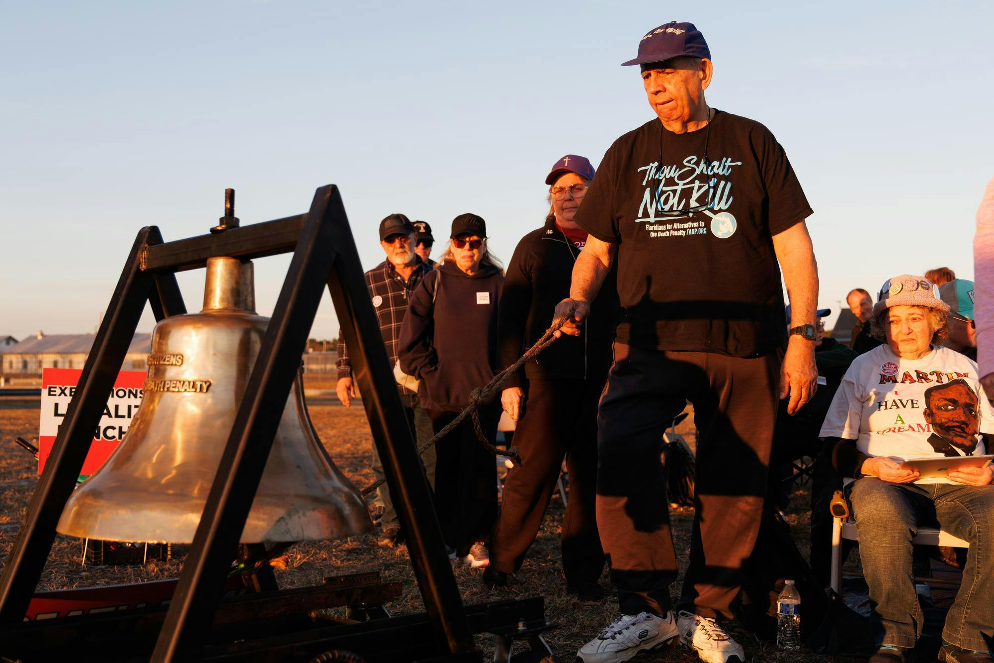 Joe Cinesi, a protester in opposition to the execution of Ronald Palmer Heath, rings the Delaware Bell outside Florida State Prison. Heath was executed in Raiford on Tuesday, Feb. 10, 2026.