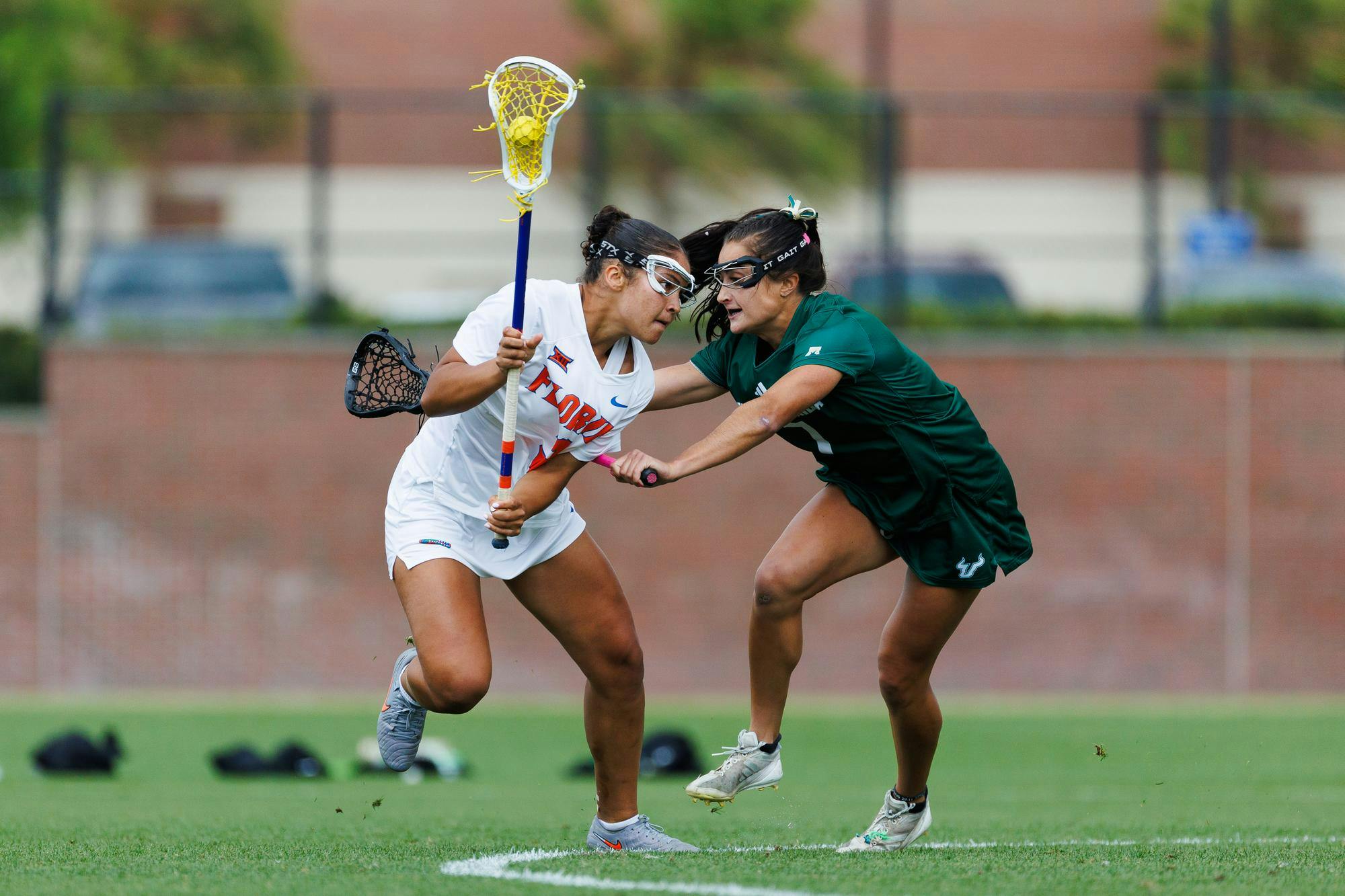 Florida attacker Autumn Blair (3) tries to run around a defender during an NCAA Lacrosse game against South Florida, Wednesday, April 8, 2026, in Gainesville, Fla.