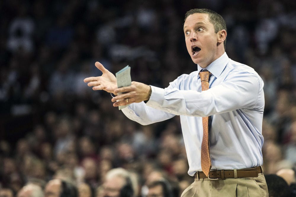 <p>Florida head coach Mike White communicates with players during the first half of an NCAA college basketball game against South Carolina Wednesday, Jan. 18, 2017, in Columbia, S.C. (AP Photo/Sean Rayford)</p>