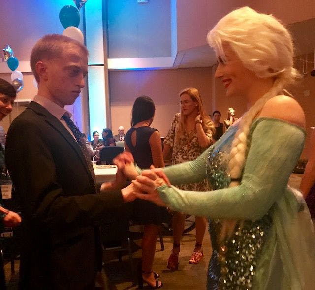 Guest David Ison is dancing with Jeana Fraser, UF sophomore serving with Project Princess as Queen Elsa.
