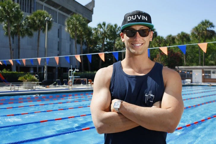 Rex Tullius poses for a picture Monday afternoon in front of the Florida Pool.