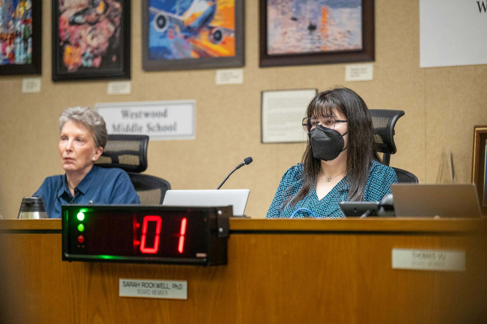 Alachua County Public Schools board member Sarah Rockwell watches a speaker as the clock hits one second on their allotted time during a board meeting on Tuesday, April 15, 2025, in Gainesville, Fla.
