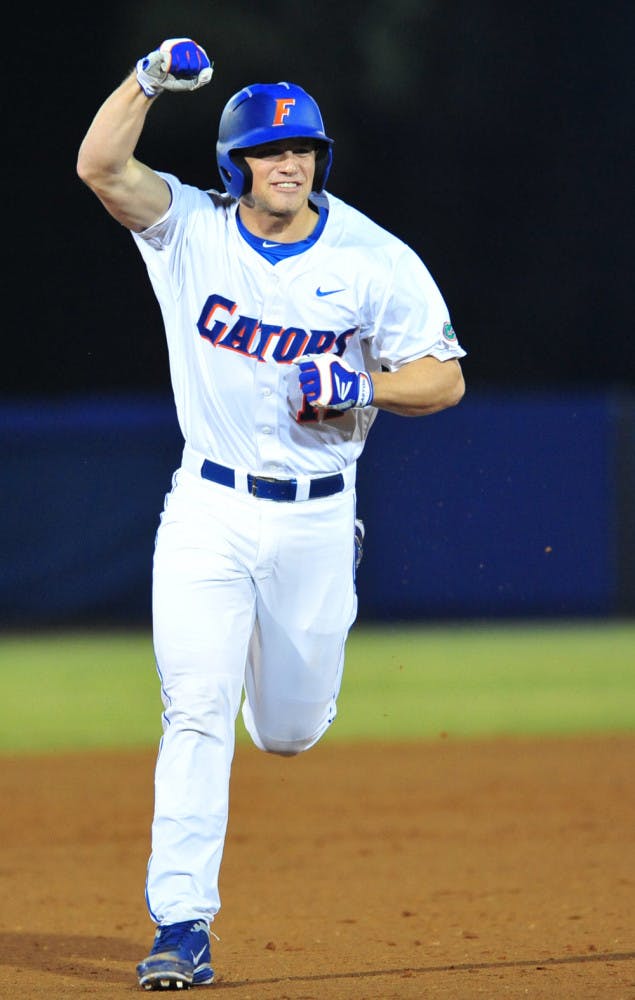 Freshman Taylor Gushue rounds the bases after belting an
opposite-field home run on the first pitch of his first college
at-bat during Florida's 7-3 win against Cal State Fullerton on
Friday. 