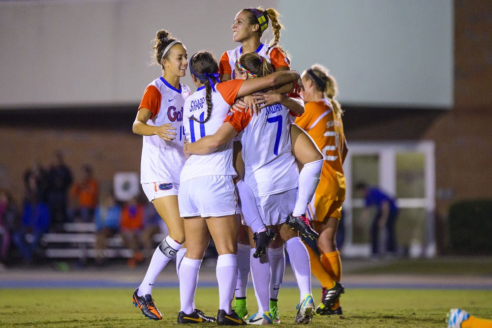UF soccer players celebrate Savannah Jordan's header goal during Florida's 3-1 win against Tenessee on Friday.