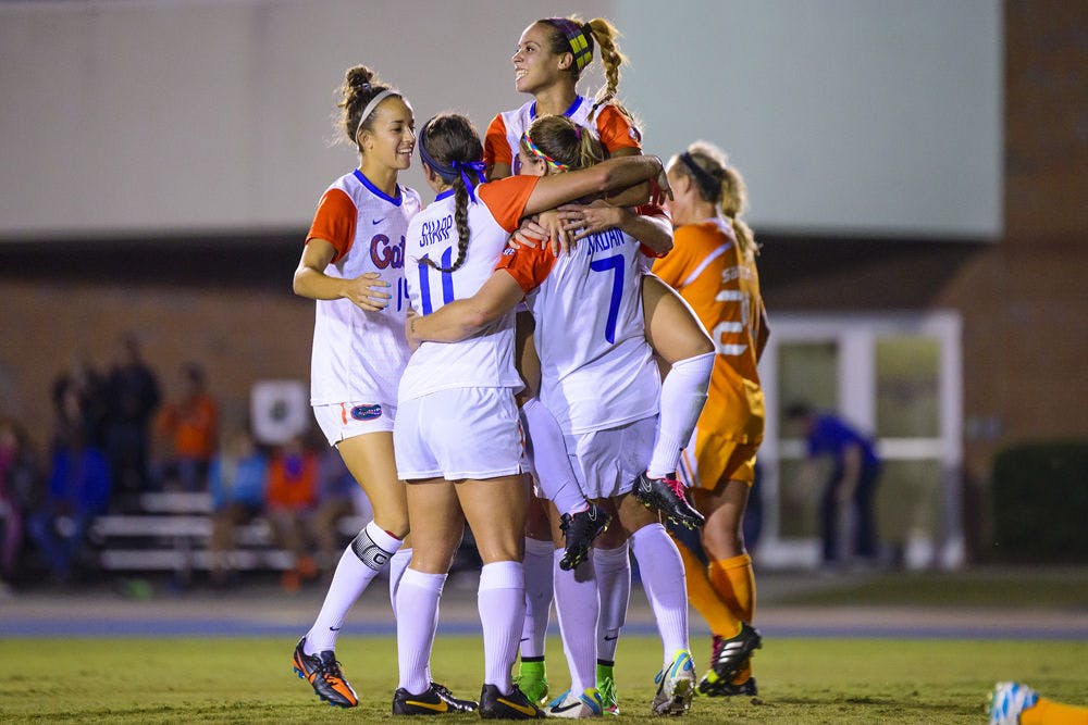 <p>UF soccer players celebrate Savannah Jordan's header goal during Florida's 3-1 win against Tenessee on Friday.</p>