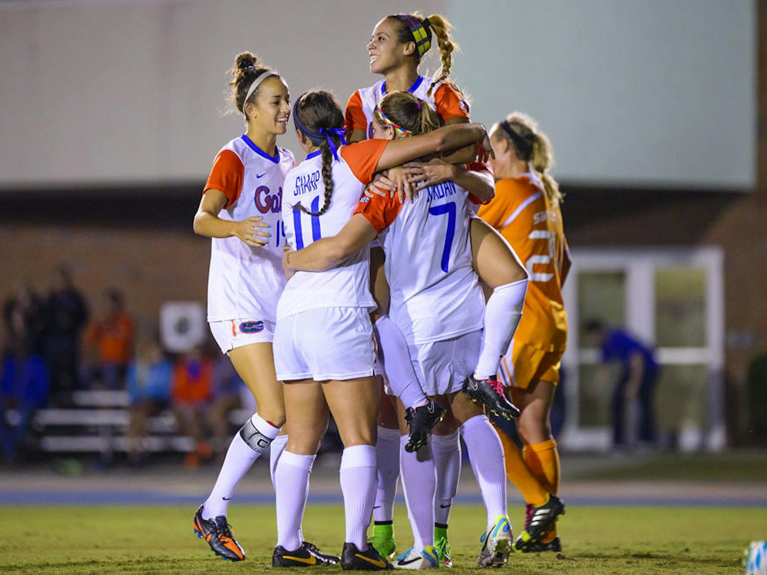 UF soccer players celebrate Savannah Jordan's header goal during Florida's 3-1 win against Tenessee on Friday.