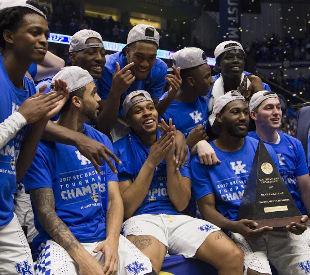 <p>Kentucky players celebrate after the Wildcats won the Southeastern Conference Tournament on March 12, 2017, in Nashville, Tennessee.</p>