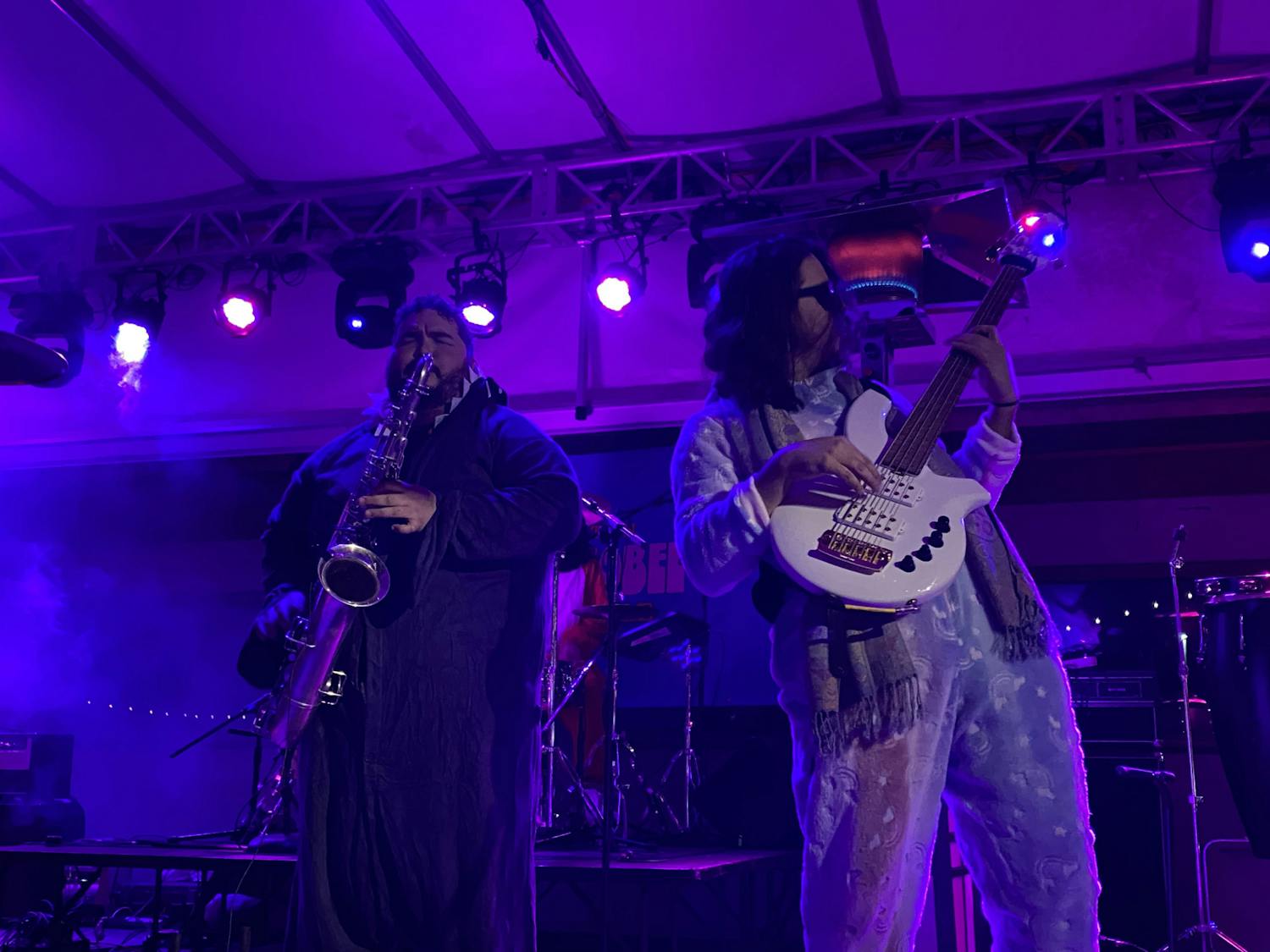 Sebastian Sayavedra and Jose Piñeiro of Dionysus bundled up in onesies during the unexpectedly cold night. Photo taken by Aurora Jiménez Castro on Jan. 29.