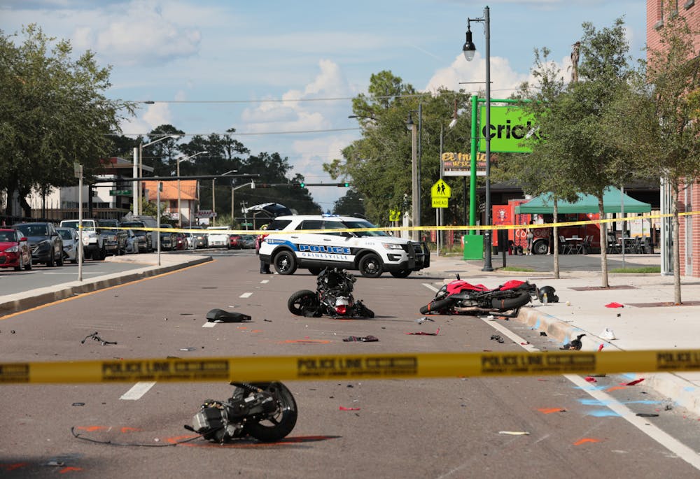 <p>Remnants of a motorcycle accident are seen on the corner of 3rd Avenue and West University Avenue in front of Krispy Kreme on Friday, Oct. 1, 2021.<br/></p>