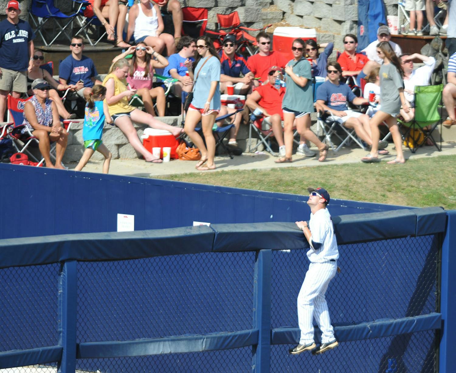 Mississippi's Tanner Mathis (12) watches as the ball clears the fence on a three-run home run hit by Florida's Vickash Ramjit during a college baseball game in Oxford, Miss. on Saturday, March 31, 2012. (AP Photo/Oxford Eagle, Bruce Newman)