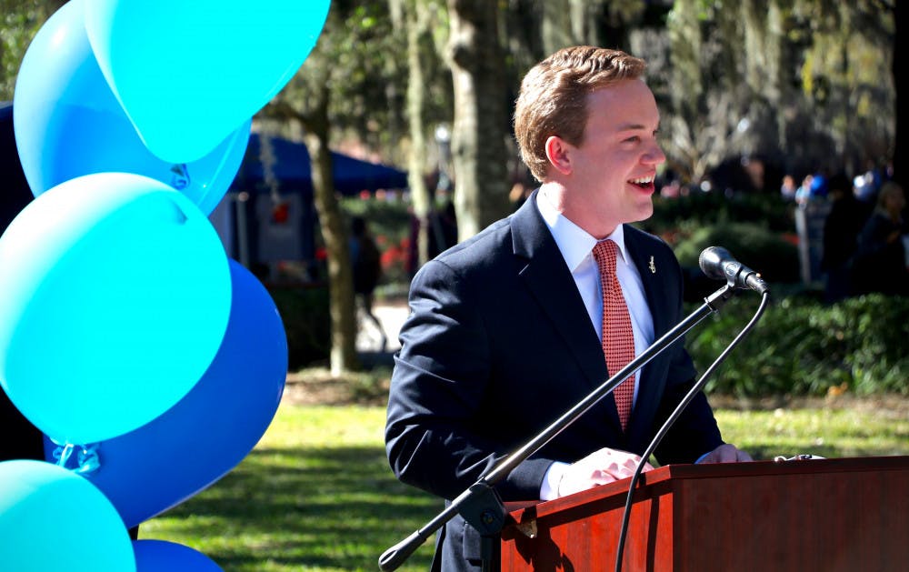 Smith Meyers, a 22-year-old UF food and resource economics senior and the Impact Party candidate for Student Body president, delivers his acceptance speech in front of Century Tower for a crowd of more than 50 people. Meyers stated that "character is what will guide how I lead this campus forward."