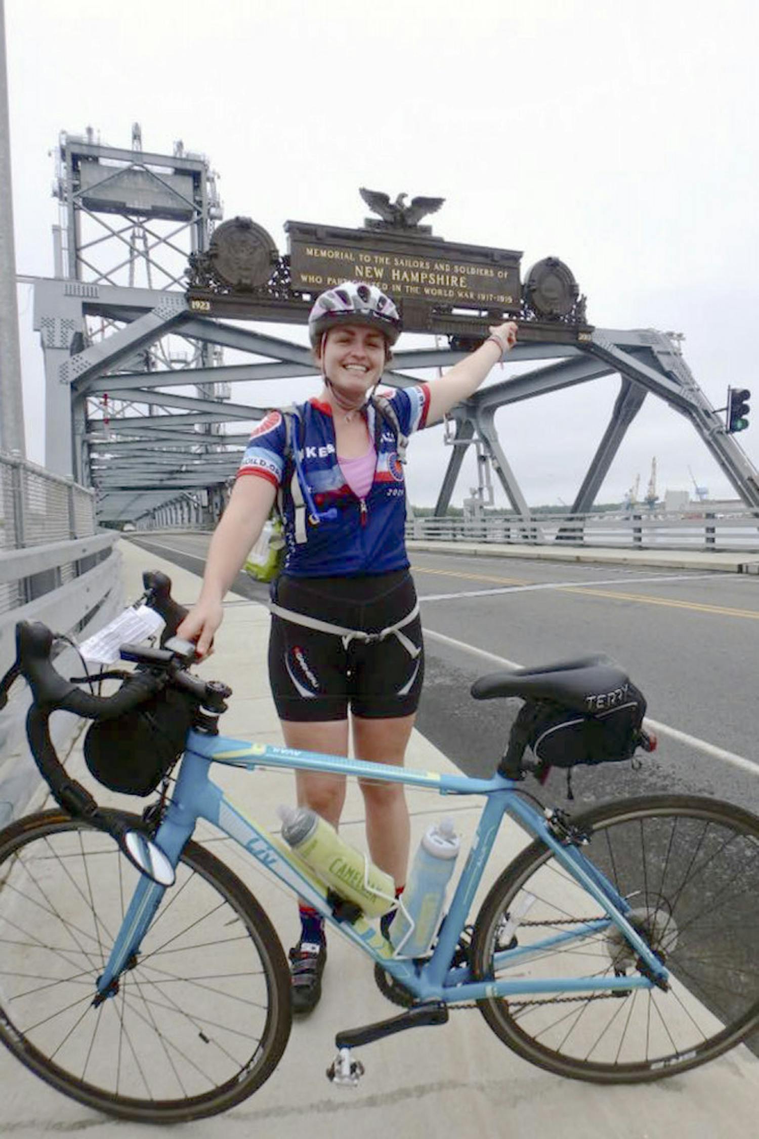 Bridget Anderson, a 22-year-old UF graduate, stands on the World War I Memorial Bridge in Portsmouth, New Hampshire, during her bike trip across the country. Another UF alum, 25-year-old Patrick Wanninkhof, died during the trip in a car accident when he and Anderson were hit by a distracted driver.