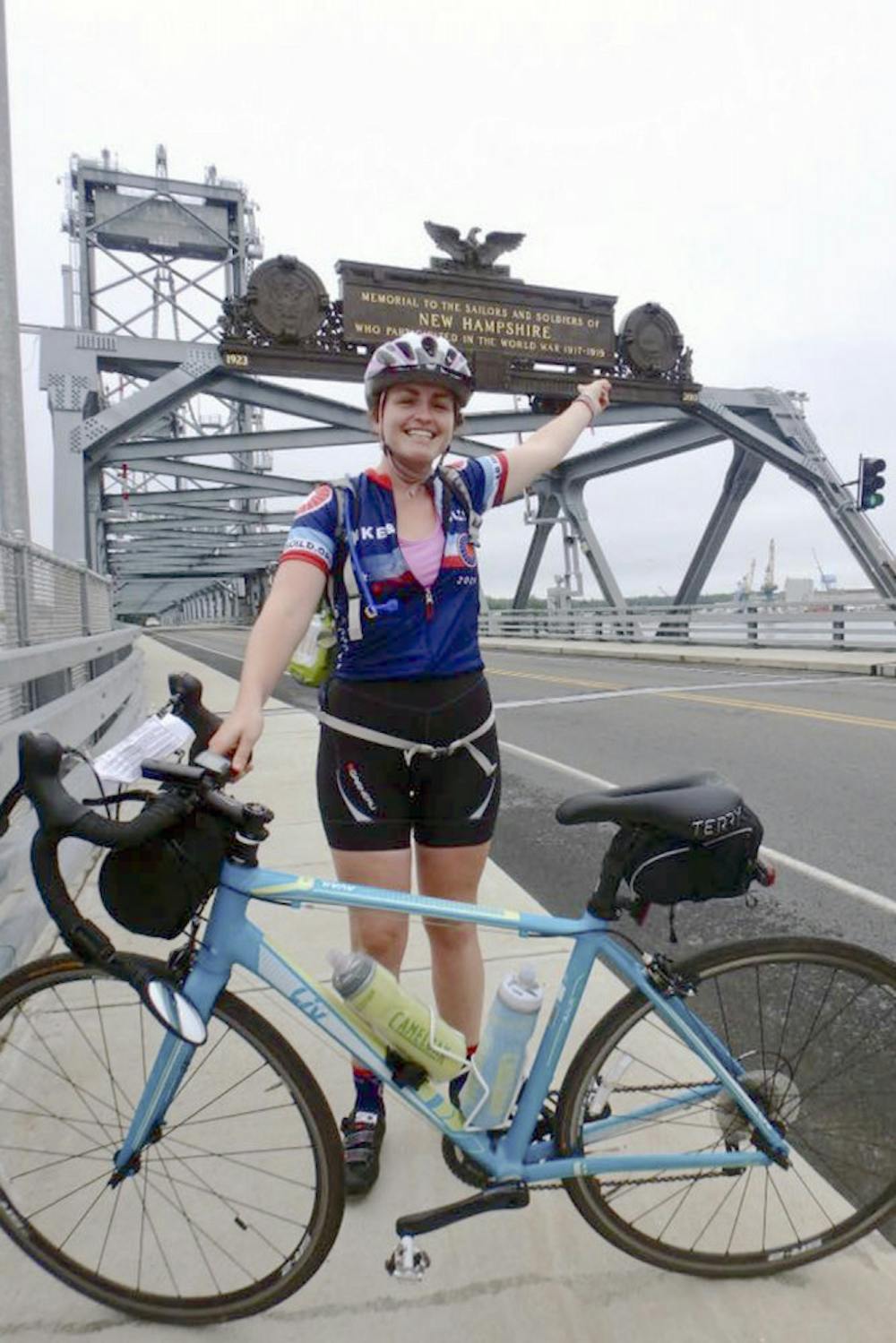 <p>Bridget Anderson, a 22-year-old UF graduate, stands on the World War I Memorial Bridge in Portsmouth, New Hampshire, during her bike trip across the country. Another UF alum, 25-year-old Patrick Wanninkhof, died during the trip in a car accident when he and Anderson were hit by a distracted driver.</p>