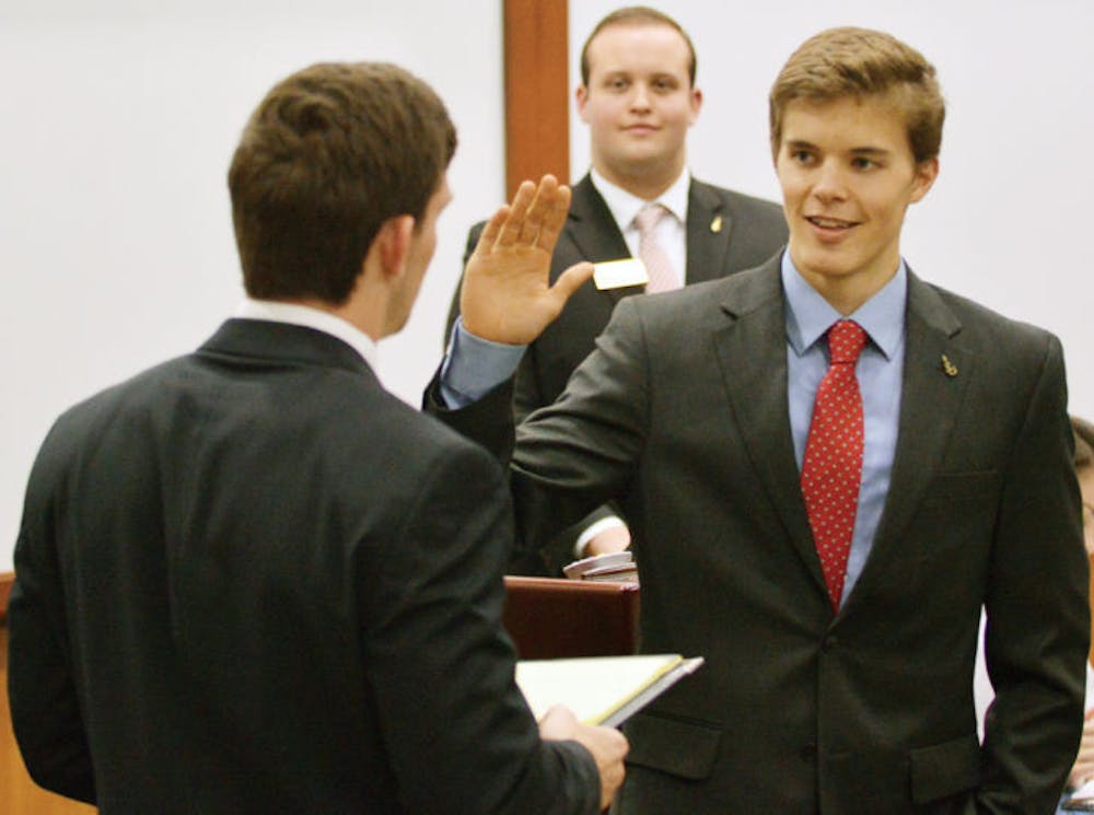 <p>Sen. Dylan Fisher is sworn in as the new Student Senate president on Tuesday at the first Student Government meeting since elections. Read the story on page 8.</p>