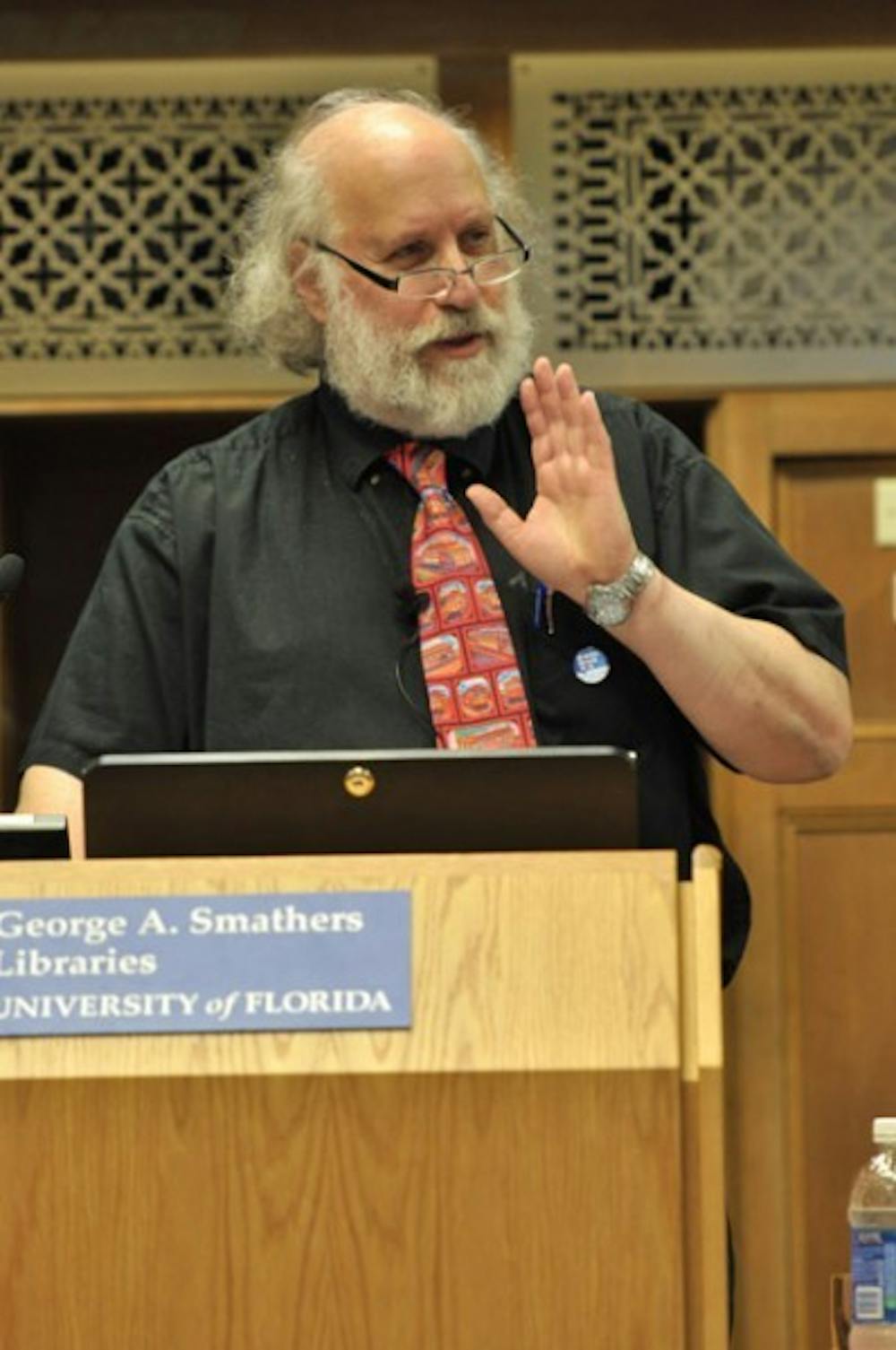 <p>Cary Nelson, a professor at the University of Illinois Urbana-Champaign, speaks Monday night in Smathers Library about corporate-sponsored academic research. His advice--to collect and unionize--is founded "because students and faculty don't assert their solidarity," something he's seen happen when colleges take money in exchange for corporate grants.</p>