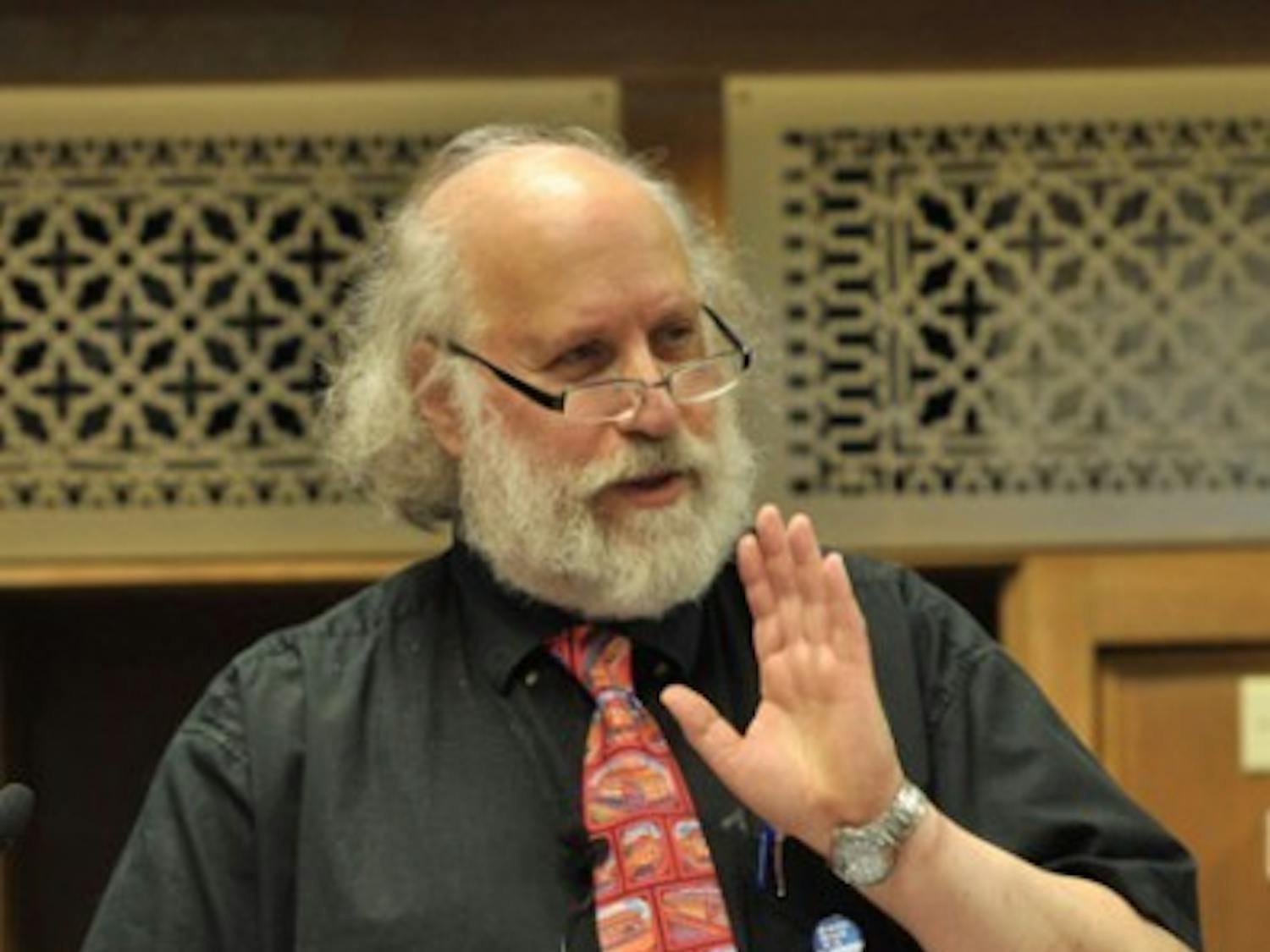 Cary Nelson, a professor at the University of Illinois Urbana-Champaign, speaks Monday night in Smathers Library about corporate-sponsored academic research. His advice--to collect and unionize--is founded "because students and faculty don't assert their solidarity," something he's seen happen when colleges take money in exchange for corporate grants.