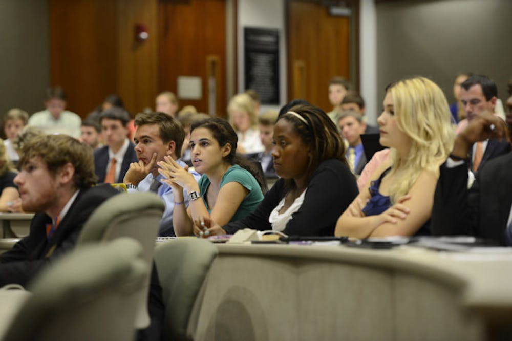 <p>UF District D senator Daniella Saetta, second from left at desk, questions Supervisor of Elections Justin Hoover on the Fall 2013-2014 election contingency plan in Student Senate on Tuesday.</p>