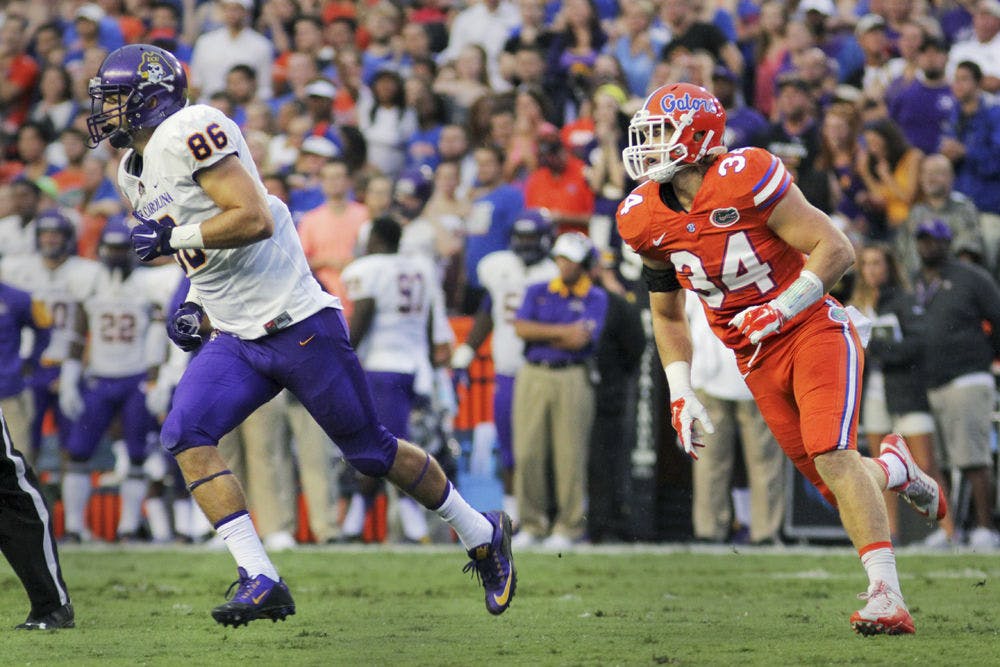 <p dir="ltr" align="justify">UF linebacker Alex Anzalone pursues East Carolina tight end Stephen Baggett during the Gators' 31-24 win against the Pirates on Sept. 12, 2015, at Ben Hill Griffin Stadium.</p>