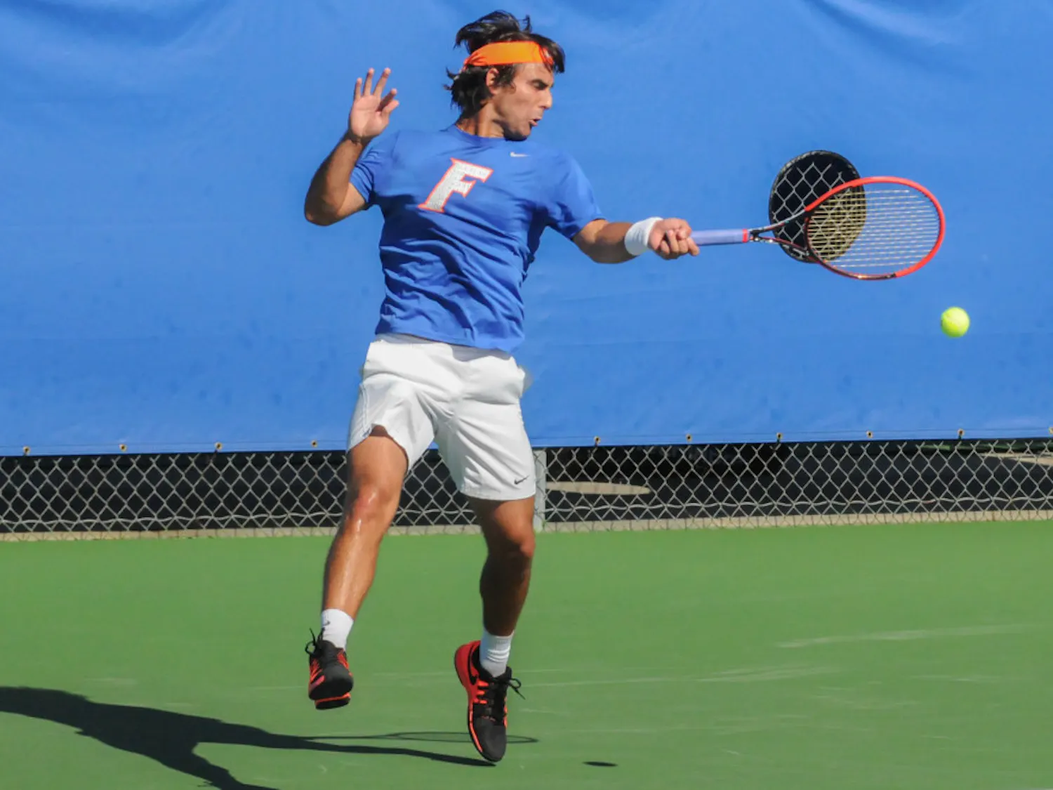 Diego Hidalgo returns a serve during Florida's 6-1 win over Troy on Jan. 17, 2016, at the Ring Tennis Complex.