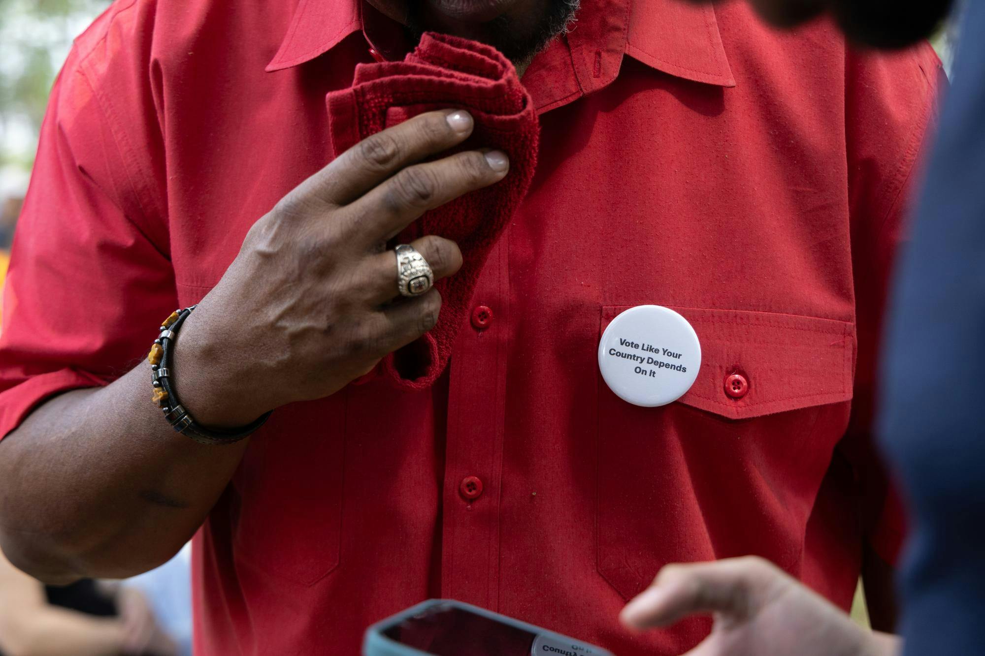 Gary Neal speaks to an attendant of the No Kings Protest at Cora P. Roberson Park, Saturday, March 28, 2026 in Gainesville, Fla.