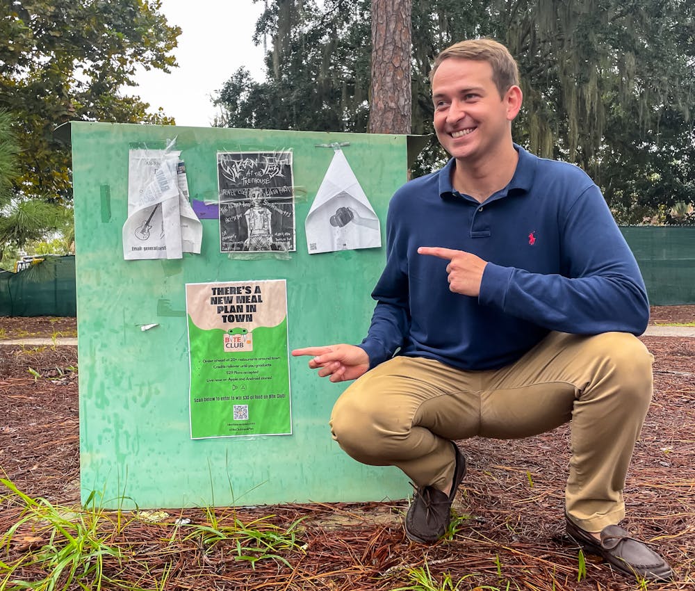 <p>Bite Club Founder Jack Warman poses next to a Bite Club poster outside Marston Library on Friday, Sept. 13, 2024. Courtesy of Jack Warman.</p>