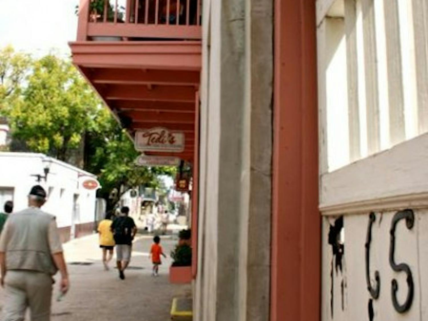 People walk past the Benet House, now Tedi's Olde Tyme Ice Cream, in downtown St. Augustine on a Tuesday afternoon in September 2008.&nbsp;