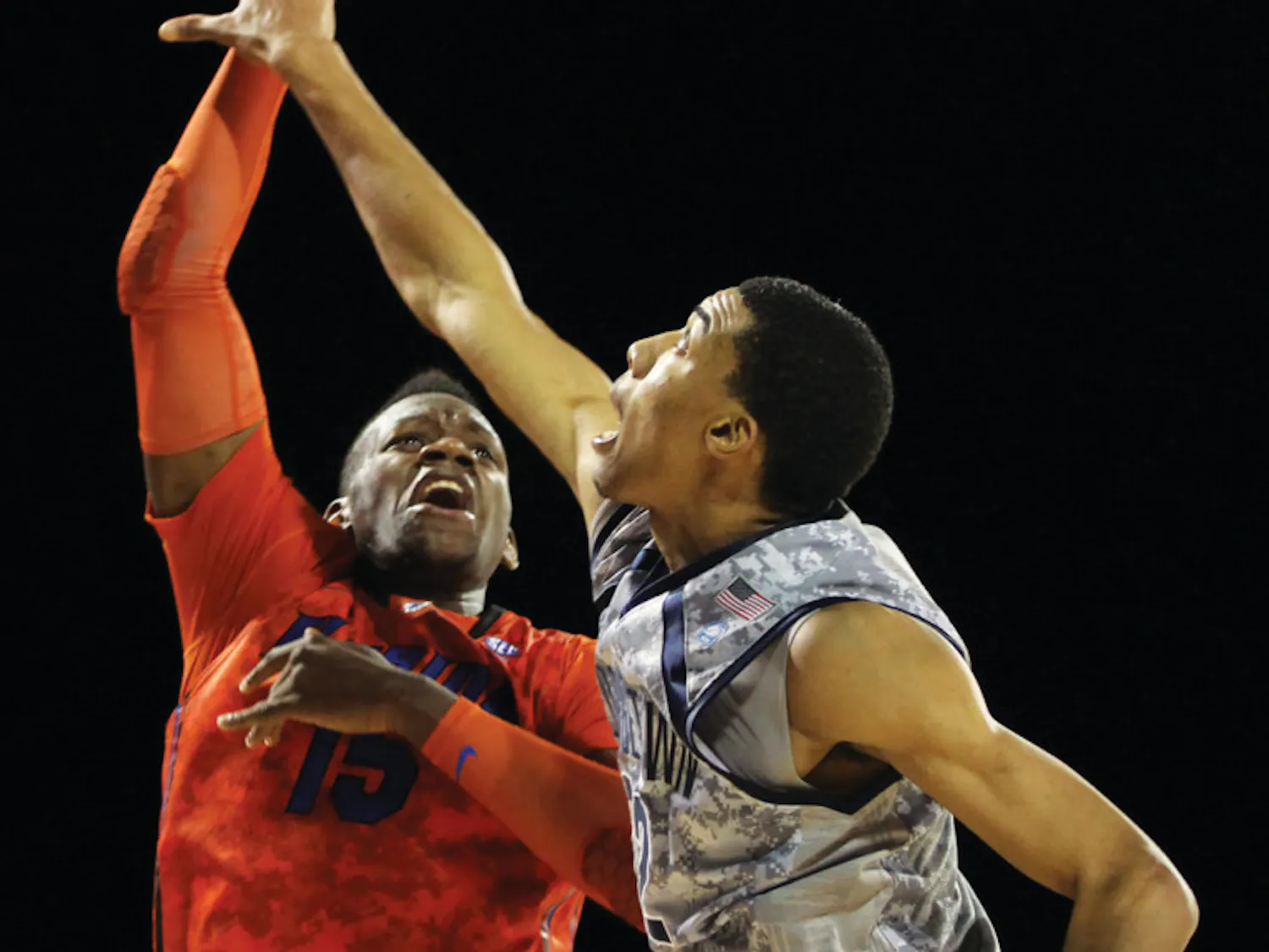 Florida forward Will Yeguete (15) attempts a shot against Georgetown forward Otto Porter on Nov. 9 aboard the USS Bataan in Jacksonville.