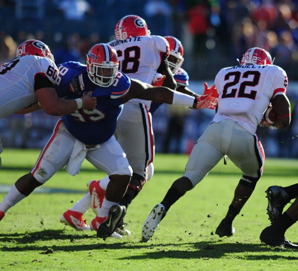 Running back Richard Samuel (22) and the Georgia rushing attack helped the Bulldogs control the second half of Saturday’s game.