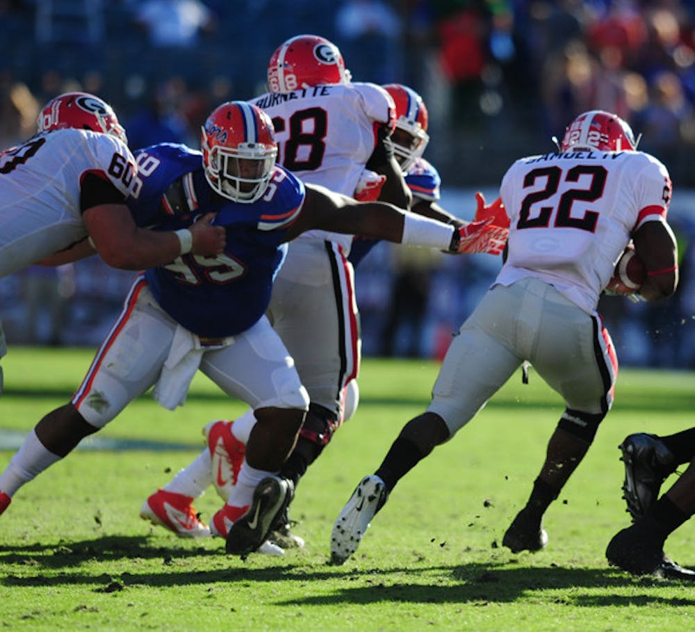 <p>Running back Richard Samuel (22) and the Georgia rushing attack helped the Bulldogs control the second half of Saturday’s game.</p>
