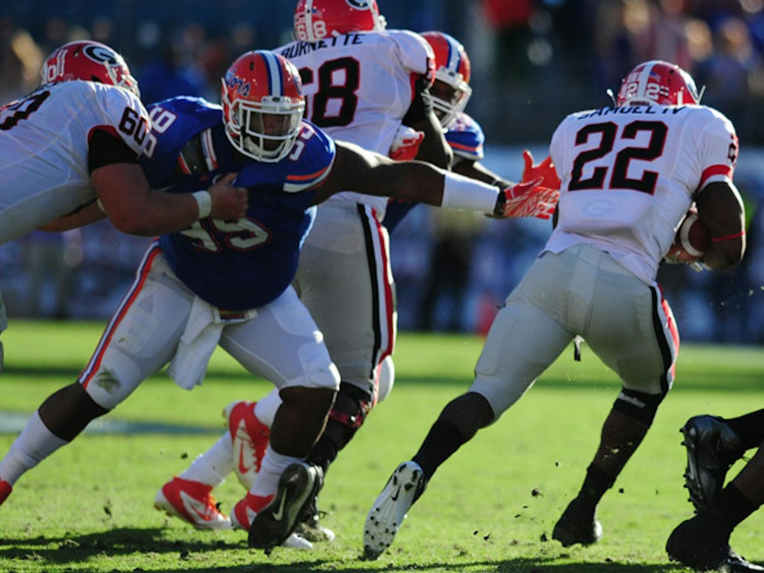 Running back Richard Samuel (22) and the Georgia rushing attack helped the Bulldogs control the second half of Saturday’s game.