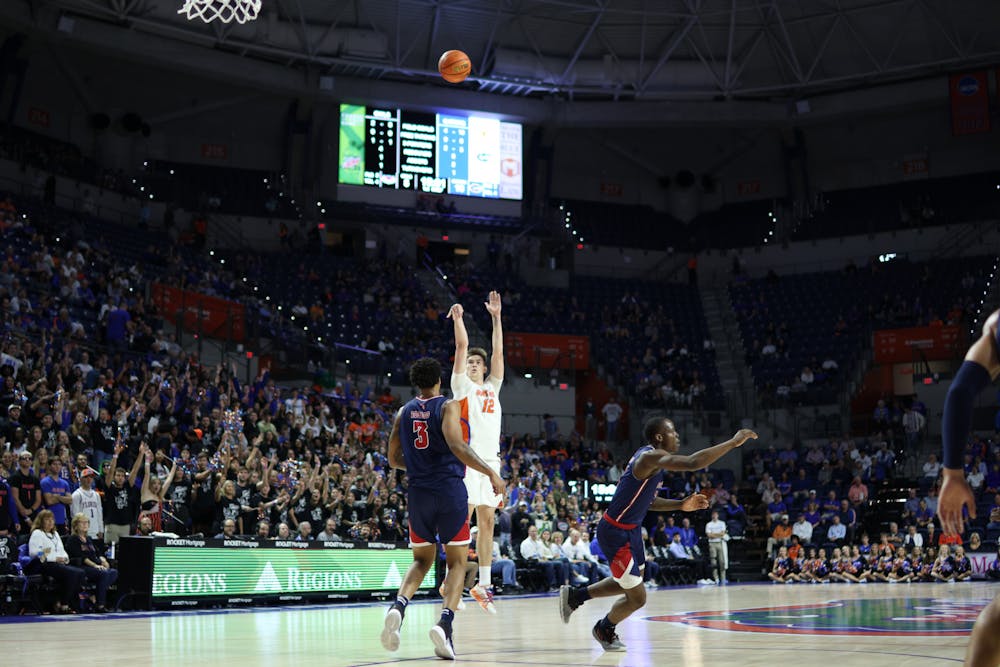 Florida forward Colin Castleton shoots a 3-pointer against the Florida Atlantic Owls Monday, Nov. 14. Castleton scored 30 or more points for the second straight game in the loss to FAU. 