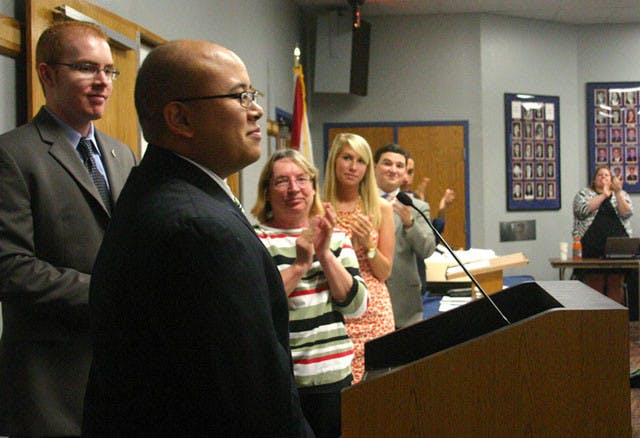 Student Body President Anthony Reynolds is applauded by Student Government Senate members after being sworn in at Tuesday's meeting.