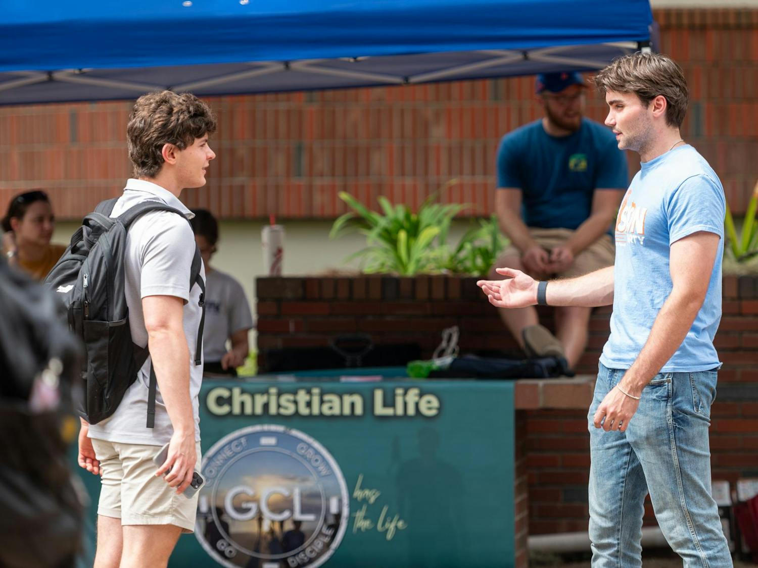 Members of the Vision Party campaign to students around the UF campus in Gainesville, Fla., on Tuesday, Sept. 30, 2025. This is the first election in recent years in which only one party is running.
