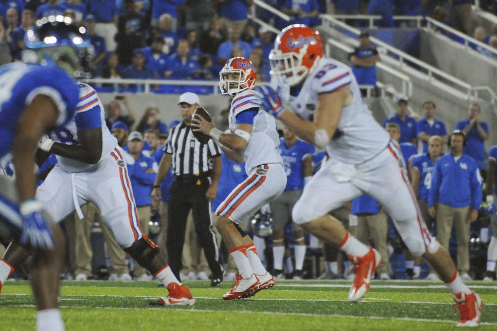 <p dir="ltr" align="justify">UF quarterback Will Grier drops back to pass during Florida's 14-9 win against Kentucky on Sept. 19, 2015,&nbsp;at Commonwealth Stadium in Lexington, Kentucky.</p>