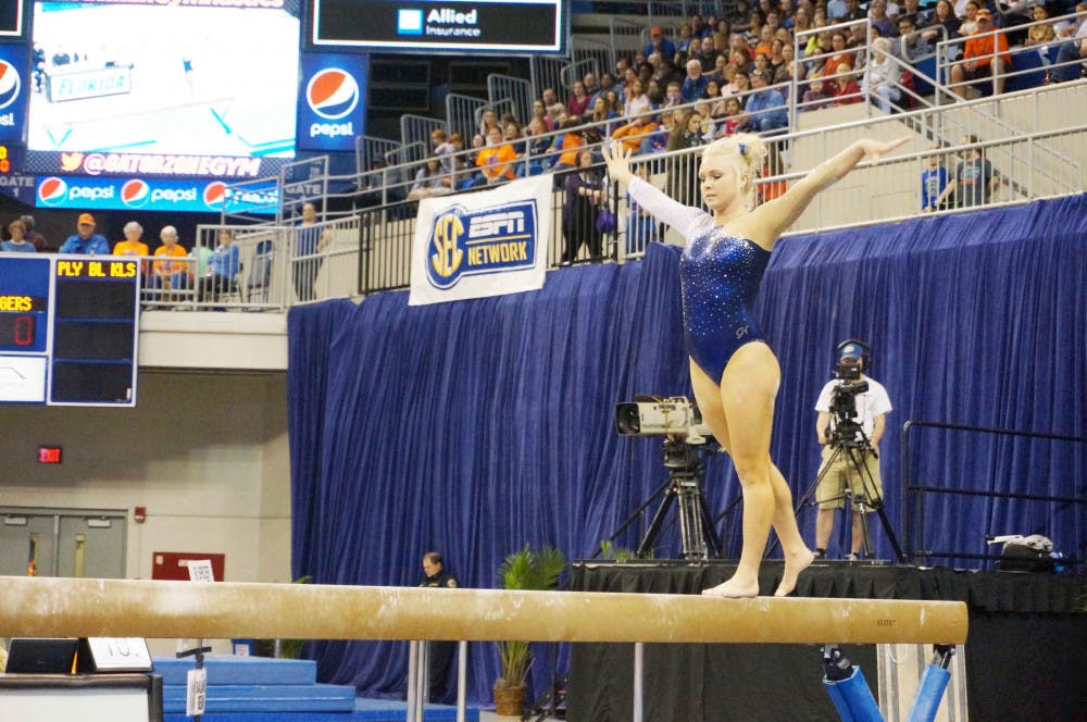 <p>Rachel Spicer performs a balance beam routine during Florida's win against Auburn on Friday in the O'Connell Center.</p>
