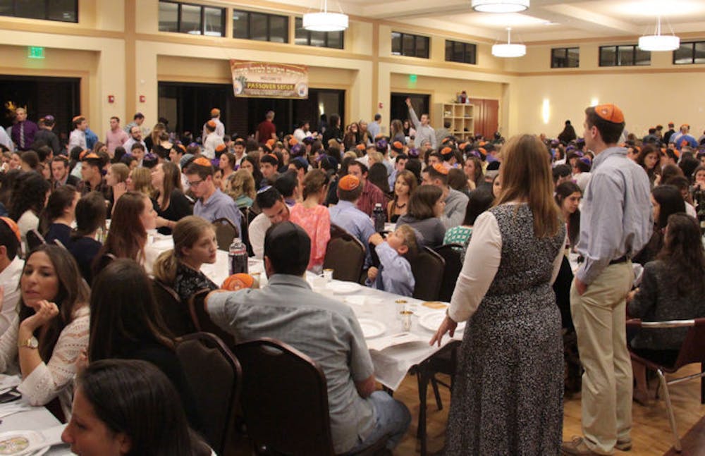 <p class="p1">Students and residents gather at the Lubavitch-Chabad Jewish Student and Community Center for Seder on Monday evening. The event celebrated the first night of the Jewish holiday of Passover.</p>