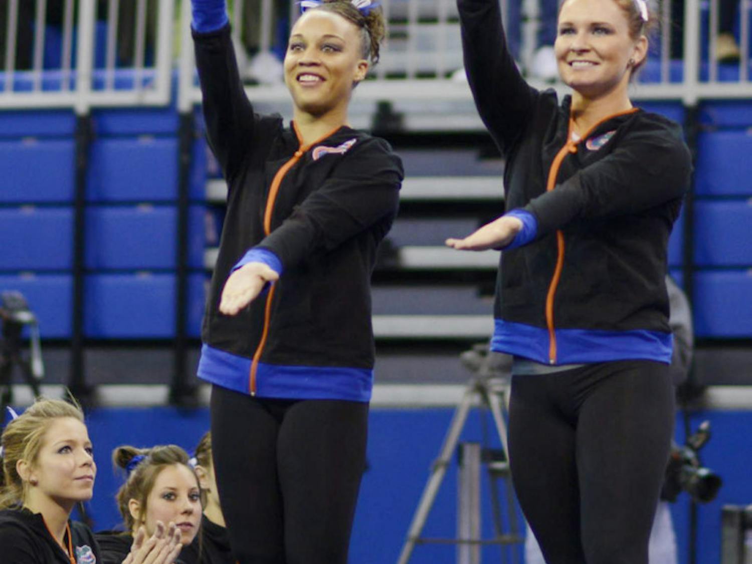 Bridget Sloan and Kytra Hunter celebrate following Florida’s match against Georgia on Jan. 24 in the O’Connell Center.