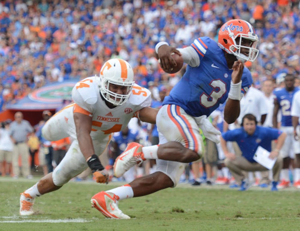 <p>Tyler Murphy runs the ball during Florida’s 31-17 win against Tennessee on Saturday in Ben Hill Griffin Stadium. The junior quarterback replaced an injured Jeff Driskel and completed 8 of 14 passes for 134 yards and one touchdown.</p>