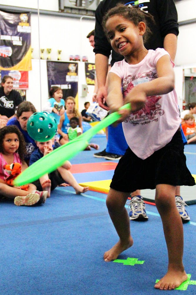 Natasha Belzaire practices her baseball skills at Balance 180 on Thursday to prepare for the culminating ceremony on Sunday.