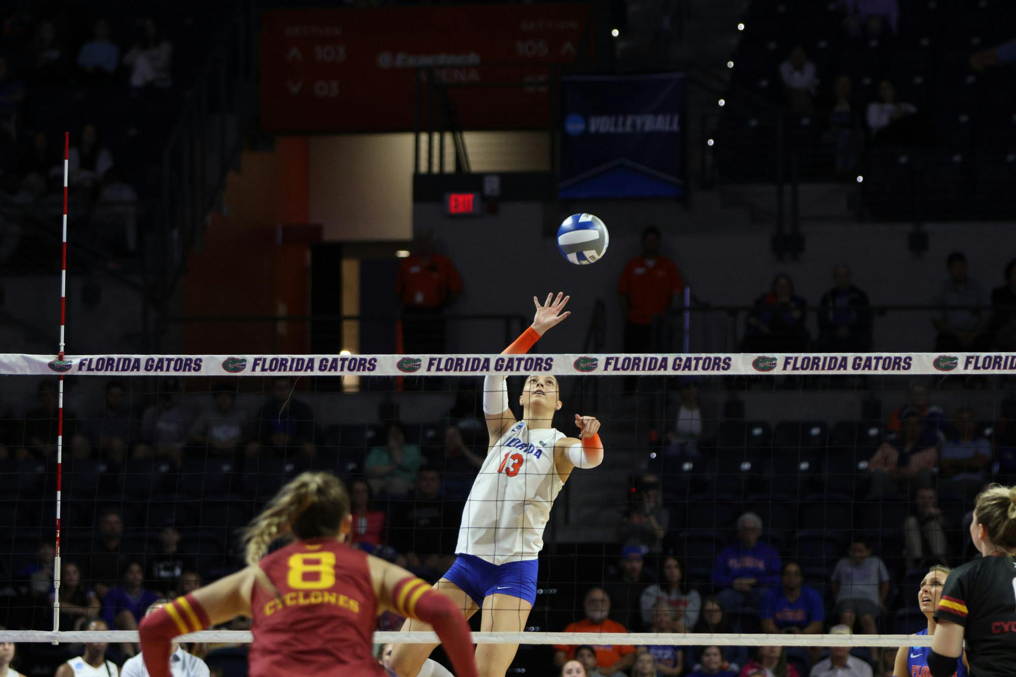 Sophomore outside hitter Merritt Beason rises high above the net to hit the ball during Florida's match against Iowa State Saturday Dec. 3, 2022. 