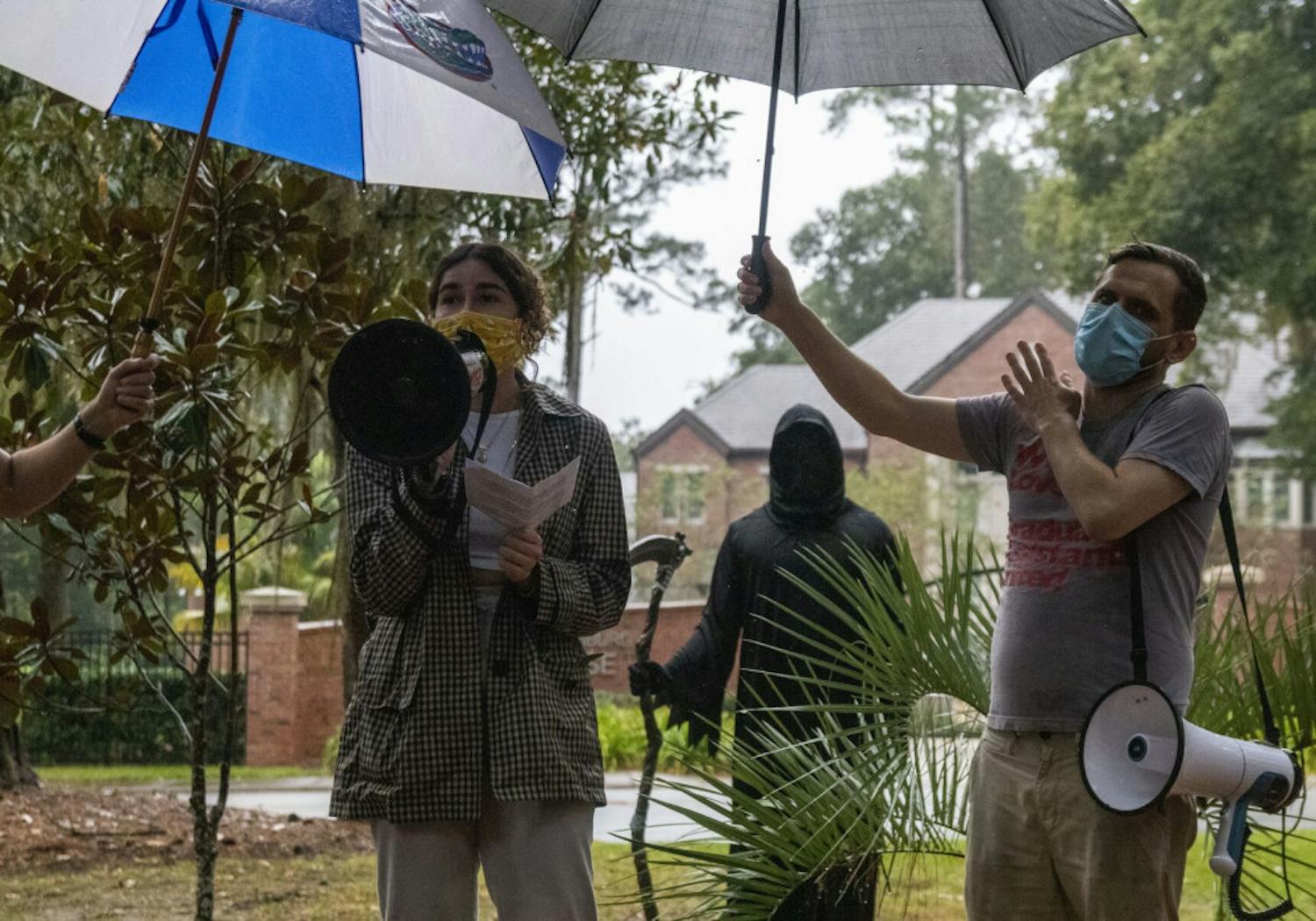 Cristina Cabada, the Alachua County Labor Coalition Coordinator, speaks to a crowd assembled across the street from the Dasburg House during a protest against in-person classes this spring at UF, on Sunday, Nov. 1, 2020.
&nbsp;