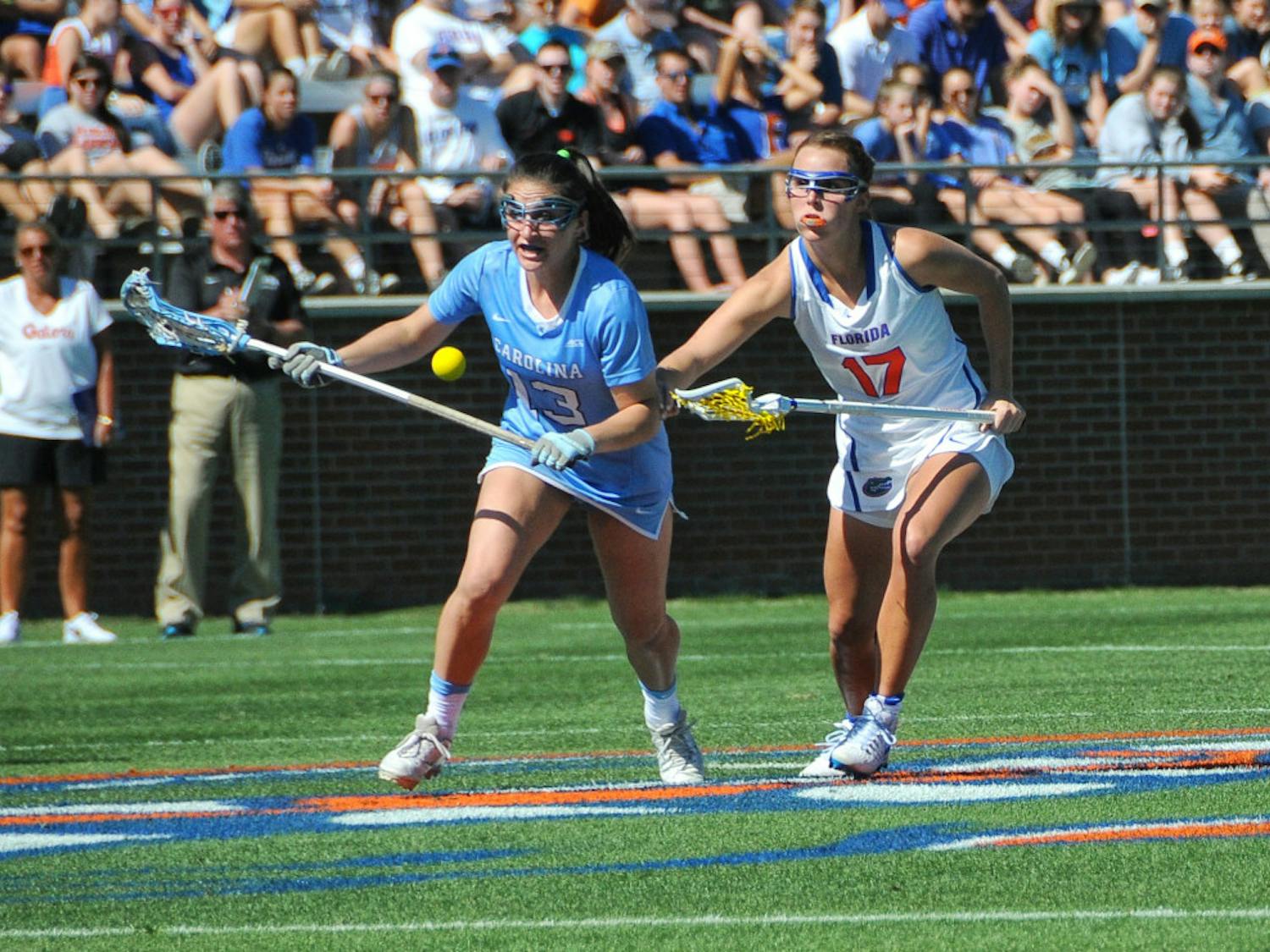 UF attacker Mollie Stevens fights off a North Carolina player during Florida's 13-10 loss to the Tar Heels on Feb. 11, 2017, at Donald R. Dizney Stadium.
