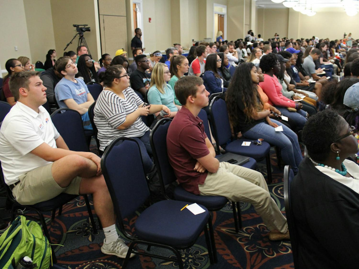 Around 250 people crowd the UF president's room at Emerson Hall for the town hall meeting with UF President Kent Fuchs on Monday. The town hall meeting focused on the relationship between the administration and diversity at UF.