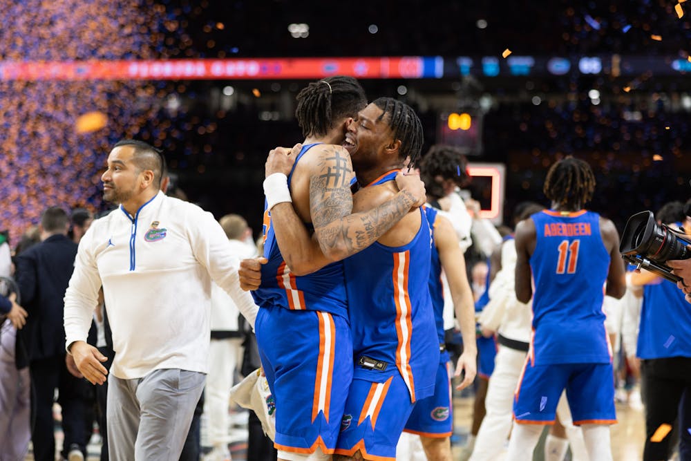 Florida Gators guard Will Richard (5) and guard Alijah Martin (15) celebrate with a hug after winning the National Championship against the Houston Cougars in the NCAA Tournament on Monday, April 7, 2025, in San Antonio, Texas.