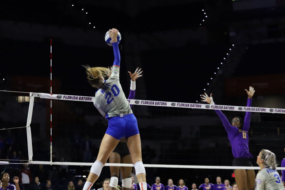 Florida&#x27;s Thayer Hall spikes a ball against LSU in 2019. Hall recorded 13 kills in a 3-1 loss to No. 17 Baylor Friday night.