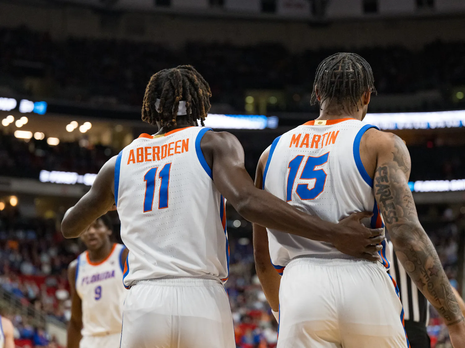 Florida Gators guard Denzel Aberdeen (11) embraces teammate Alijah Martin (15) during a basketball game against Norfolk State in the first round of the NCAA Tournament on Friday, March 21, 2025, in Raleigh, N.C.