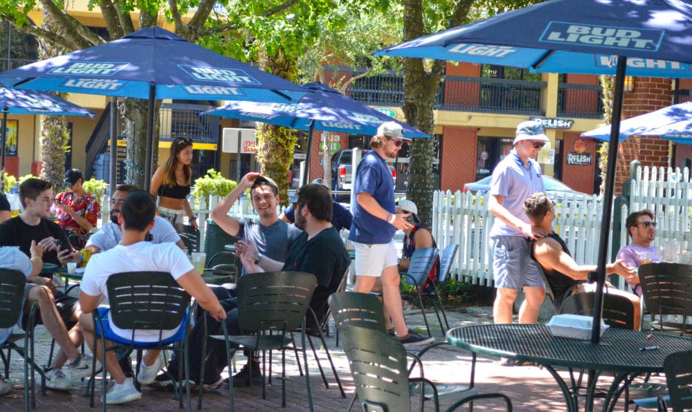 People gather at The Swamp Restaurant May 5, one day after&nbsp;Gov. Ron Desantis began to re-open the state economy.&nbsp;